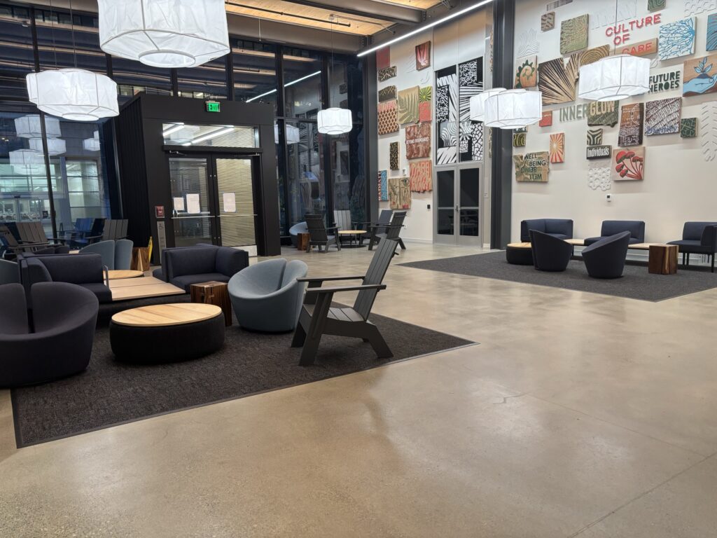 The first floor lobby of the Health Sciences Education Building, an open area with couches and chairs that students can use to study.