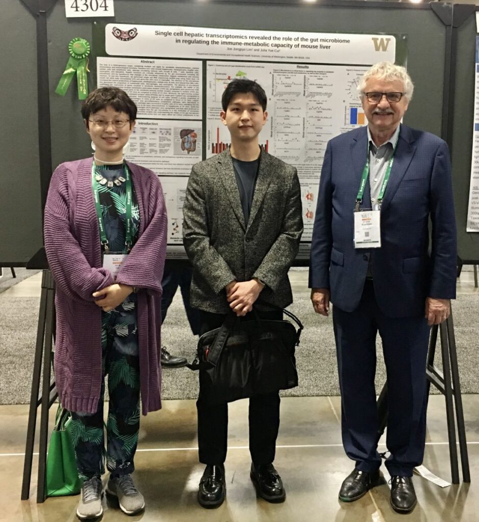 Lim stands with his mentor, Julia Yue Cui and her mentor, Curtis Klaassen.